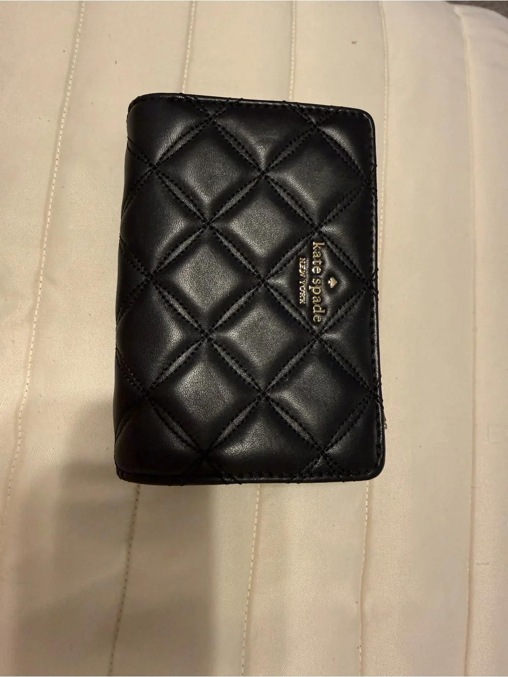 kate spade quilted black leather phone wallet with gold logo